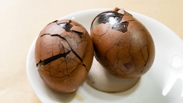 The close up of Taiwan Tea Eggs on mini white plate.