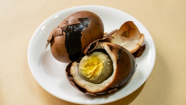 The close up of Taiwan Tea Eggs on mini white plate.