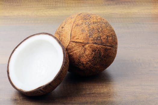 Group of fresh coconuts on wood background. 