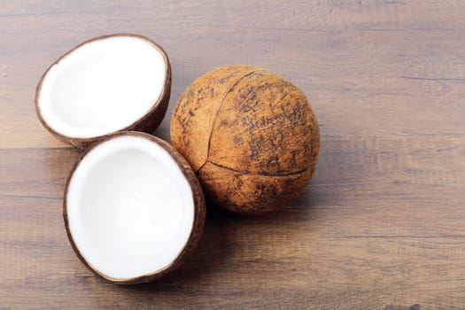 Group of fresh coconuts on wood background. 