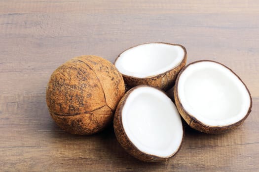 Group of fresh coconuts on wood background. 