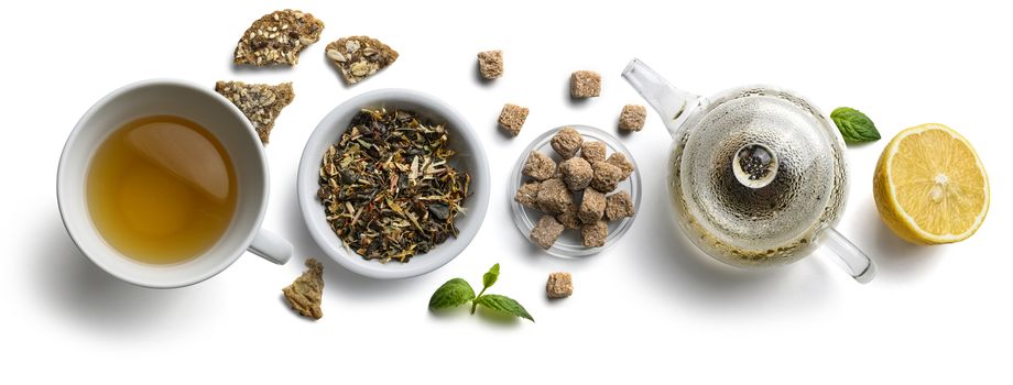 Green tea with natural aromatic additives and accessories. Top view on white background.