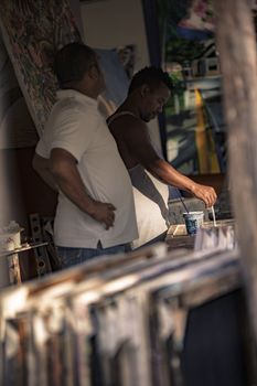 BAYAHIBE, DOMINICAN REPUBLIC 23 DECEMBER 2019: Dominican painter in Bayahibe