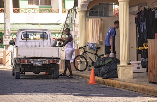 BAYAHIBE, DOMINICAN REPUBLIC 23 DECEMBER 2019: Dominican boys filmed in a moment of daily life along the streets of Bayahibe