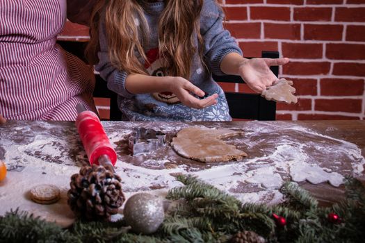 Dough and christmas cookie. Children making christmas cookies in the kitchen