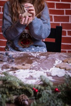 Dough and christmas cookie. Children making christmas cookies in the kitchen