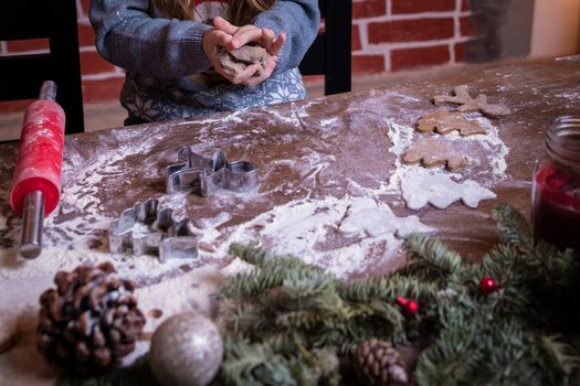 Dough and christmas cookie. Children making christmas cookies in the kitchen