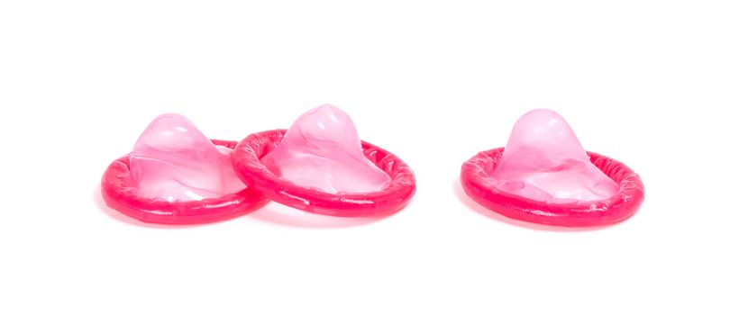 Red condom, isolated on a white background