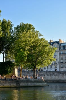 visit of Paris, Seine quay and Eiffel tower, walk in the parks of the capital of France in summer