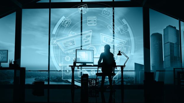 Silhouette of a girl web developer working in her office on the background of skyscrapers and infographics.