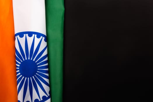 Indian republic day, flat lay top view, Indian flag on black background with copy space for your text