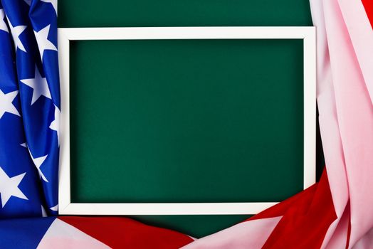 President's Day Concept, flat lay top view, America Flag and photo frame on Olive green background with copy space for your text