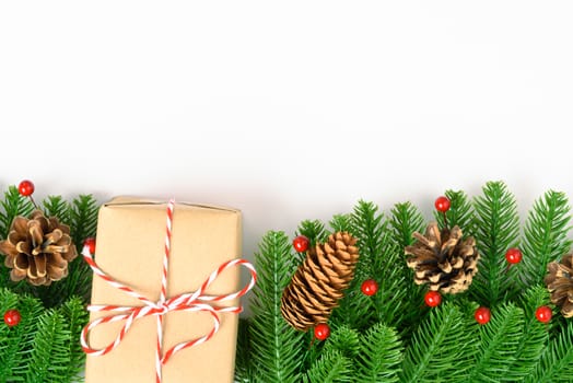 Happy new year or christmas day top view decorative fir tree and gift box on white background with copy space for your text