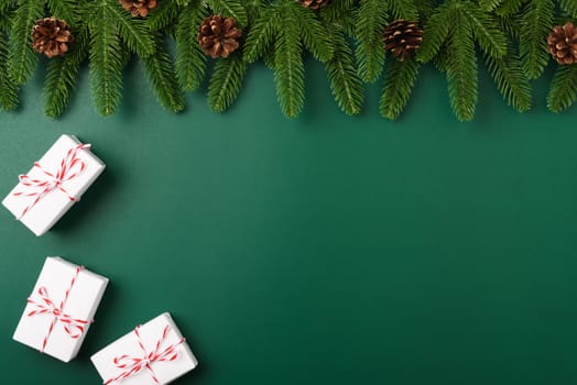 Happy new year, christmas day concept top view flat lay fir tree branches, gift box and decoration and copy space for text