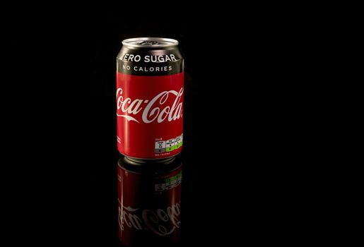 Amsterdam,28-12-2019: Coca-Cola Zero can 330 ml , no sugar, produced by The Coca-Cola Company isolated on black background, It's popular soft drink soda sold in vending machines and general store.