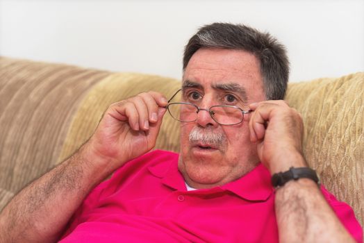 Closeup portrait senior, elderly man in glasses, looking shocked.