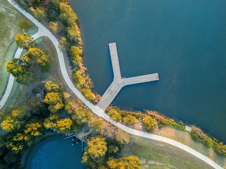 Views looking down on pretty landscaped lake and the Y jetty in Autumn