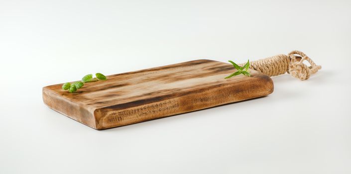 Rustic wooden cutting or serving board with handle