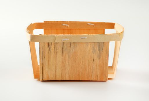 Empty rectangular wooden basket for berry fruits