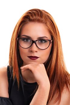 Head shot of a stunning attractive redheaded young woman with clean make up and glasses, isolated on white background. Close-up portrait of a good-looking career woman.