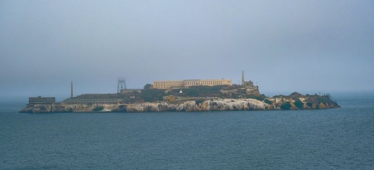 Prison of Alcatraz in rhe foggy bay
