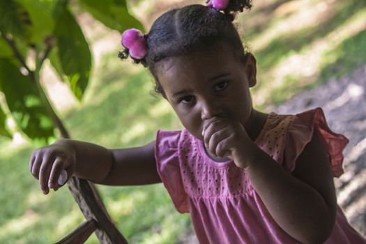 MONTANA REDONDA, DOMINICAN REPUBLIC 27 DECEMBER 2019: Expression of a poor dominican Child