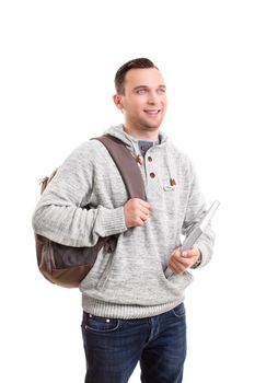 Portrait of a young male student with a backpack holding a notebook, isolated on white background.