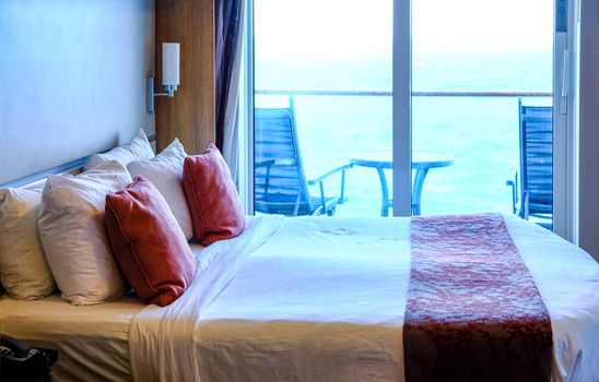 Bed on Cruise Ship with Ocean View Balcony