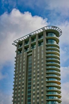 Modern condo highrise against sky