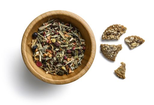 Green tea with natural aromatic additives. Top view on white background.