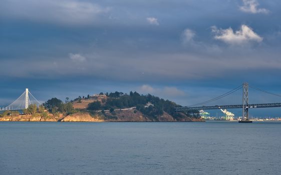 Bay Bridge Past Treasure Island in Afternoon LIght on Stormy Day