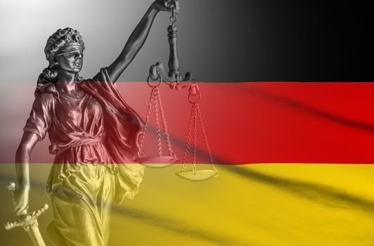 Flag of Germany with a statue of Justice holding aloft scales and a sword in a composite image conceptual of law and order