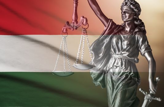 Figure of Justice superimposed on the national flag of Hungary conceptual of law and impartiality