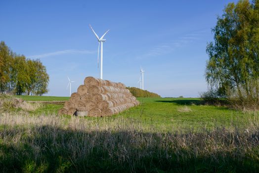 Bright blue sky moving and wind turbine.