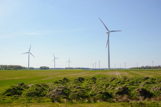 Bright blue sky moving and wind turbine.