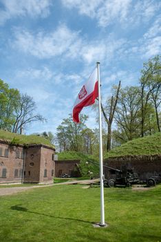 Polish flag hung on at historical lighthouse located in Swinoujscie, Poland, The construction was build in 1828 and height is 65 meters. 19th century. Top tallest Lighthouse in the World