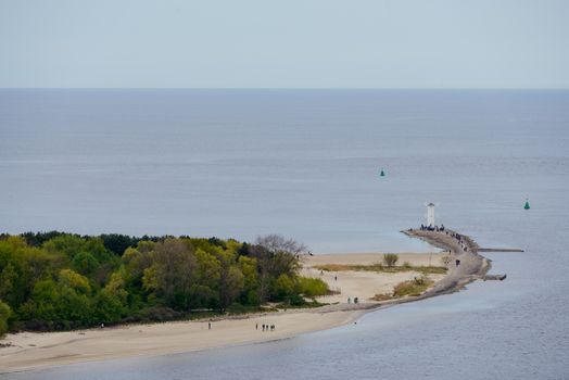 Old lighthouse in Swinoujscie, a port in Poland on the Baltic Sea. The lighthouse was designed as a traditional windmill. Panoramic image