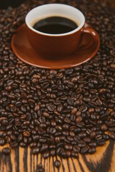 Coffee cup and beans on a background