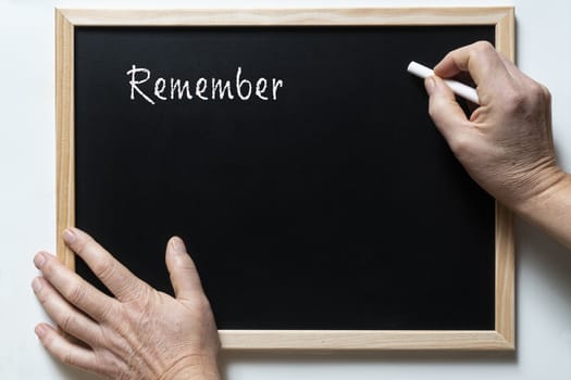 a blackboard with written  the word remember