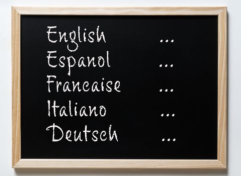 a blackboard with written some european languages