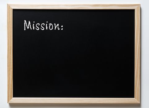 a blackboard with written  the word mission