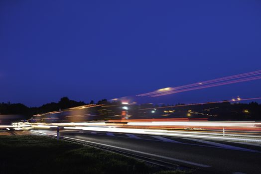 Speed Traffic - light trails on motorway highway at night, long exposure