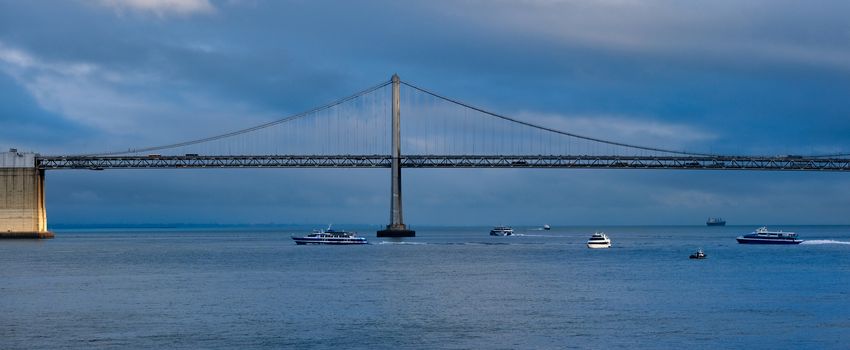 Boats Under Bay Bridge on a Stormy Blue Day