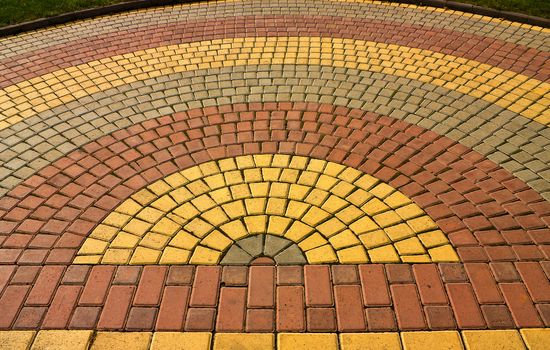 Beautiful colored paving stones of the road.