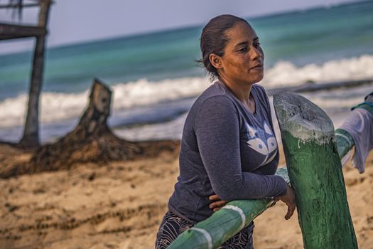 PLAYA LIMON, DOMINICAN REPUBLIC 28 DECEMBER 2019: Dominican poor woman on the beach