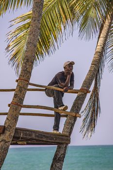 PLAYA LIMON, DOMINICAN REPUBLIC 28 DECEMBER 2019: Dominican man looks at the sea