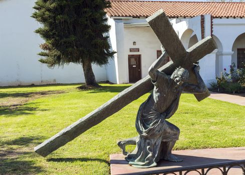 OCEANSIDE, CA - NOVEMBER 07:A statue of a Cross in front of the Spanish-Californian Mission San Luis Rey de Francia..Oceanside,California,America on November 07,2016