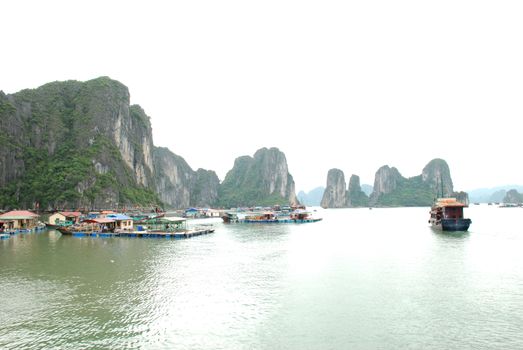 The boats and floating house in Ha Long Bay.