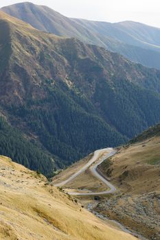 View to Transfagarasan road. It is a paved mountain road crossing the southern section of the Carpathian Mountains of Romania. It has national-road ranking and is the second-highest paved road in the country after the Transalpina.