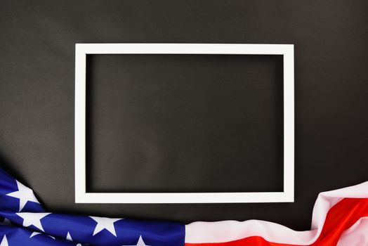 Martin luther king day, flat lay top view, American flag and photo frame on black background with copy space for your text